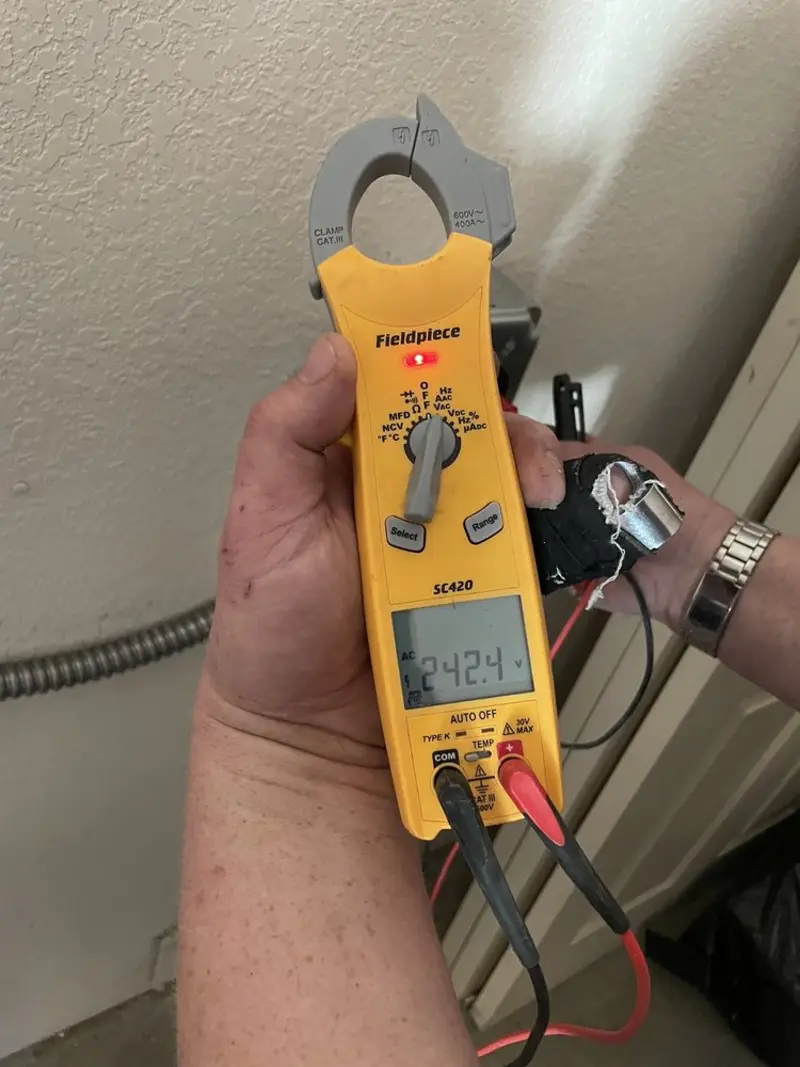 Voltage testing with clamp meter during Ceiling Fan Installation in Poplar Grove